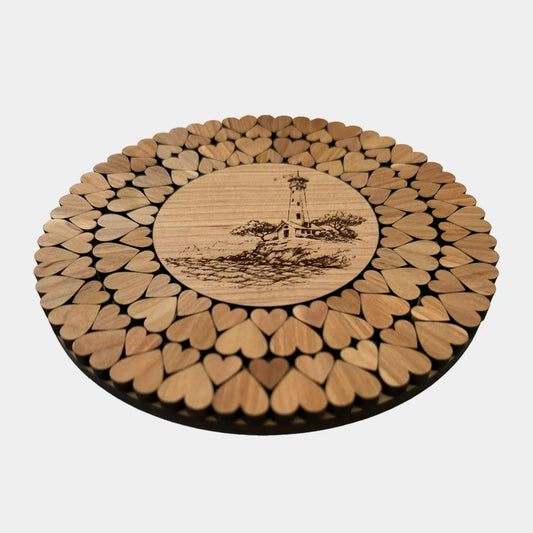Rund bordskåner med motiv af fyrtårn